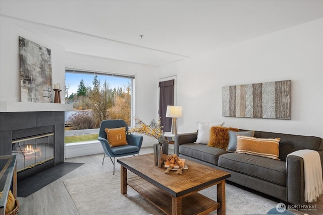 12307 NE 97th St Unit B, Kirkland, WA 98033 - living area featuring a fireplace with flush hearth and wood finished floors