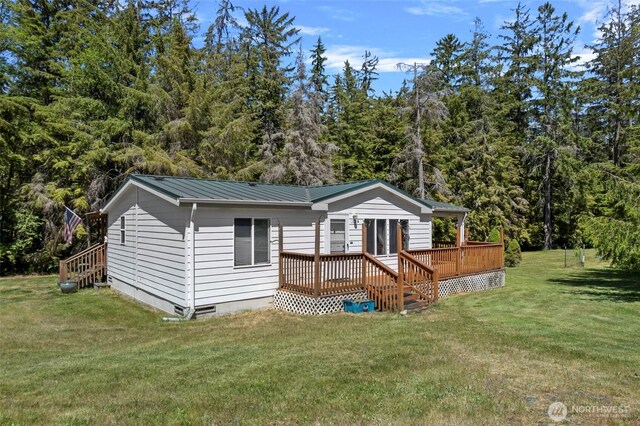 1269 Hideaway Ln, Oak Harbor, WA 98277 - back of property featuring a yard, a deck, crawl space, metal roof, and stairs