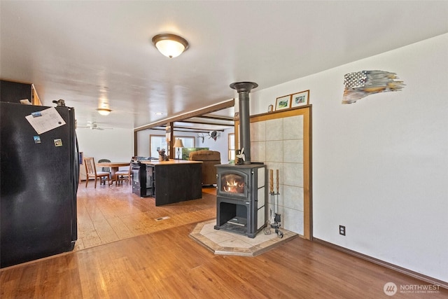 1269 Hideaway Ln, Oak Harbor, WA 98277 - living room with wood finished floors and a wood stove