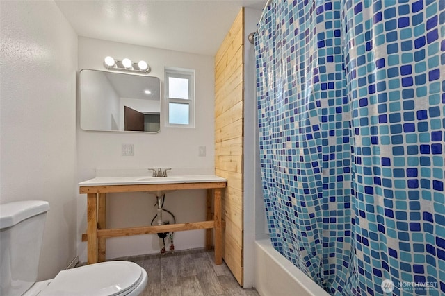 1269 Hideaway Ln, Oak Harbor, WA 98277 - full bath featuring wood finished floors, toilet, shower / tub combo, and a sink