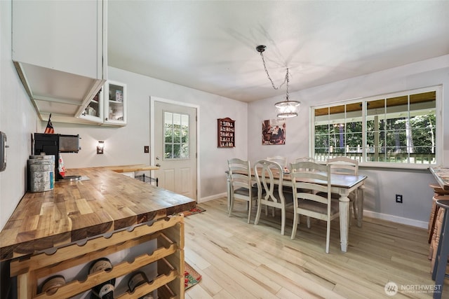 15329 Mckee Ln SE, Yelm, WA 98597 - dining area with light wood-style flooring and baseboards
