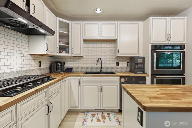 15329 Mckee Ln SE, Yelm, WA 98597 - kitchen featuring wooden counters, black appliances, a sink, and recessed lighting