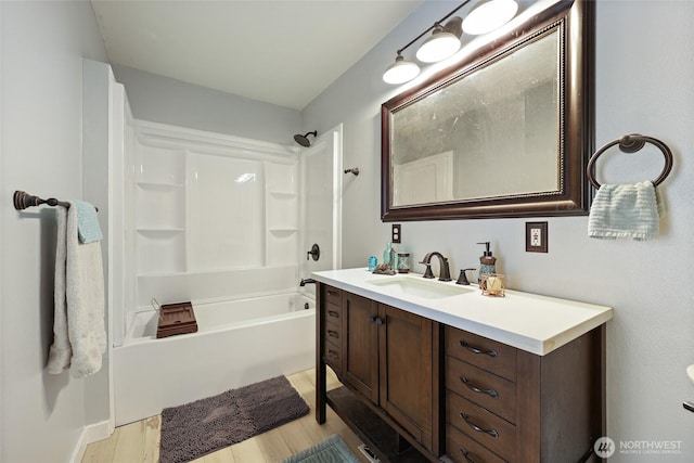 15329 Mckee Ln SE, Yelm, WA 98597 - bathroom featuring vanity, wood finished floors, and bathing tub / shower combination