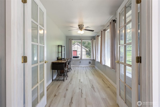 15329 Mckee Ln SE, Yelm, WA 98597 - sunroom featuring wood finished floors, baseboards, and french doors