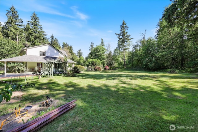 15329 Mckee Ln SE, Yelm, WA 98597 - view of grassy yard with a trampoline