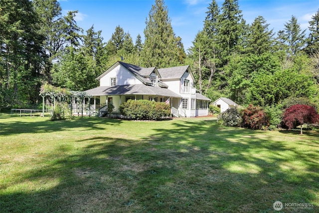 15329 Mckee Ln SE, Yelm, WA 98597 - view of side of property with a yard and roof with shingles