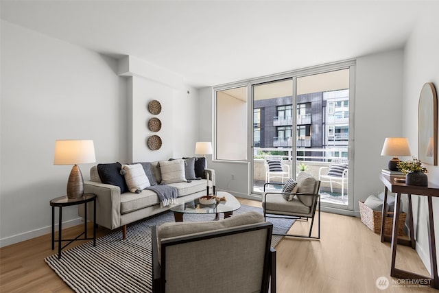 2600 2nd Ave Unit 504, Seattle, WA 98121 - living area featuring light wood-style flooring and baseboards