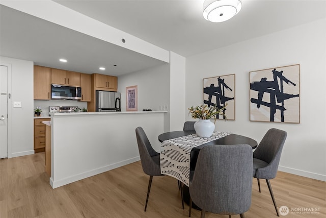 2600 2nd Ave Unit 504, Seattle, WA 98121 - dining room featuring light wood-type flooring, baseboards, and recessed lighting