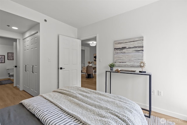 2600 2nd Ave Unit 504, Seattle, WA 98121 - bedroom featuring light wood-style flooring and baseboards