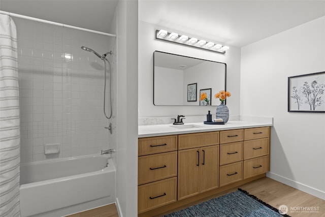 2600 2nd Ave Unit 504, Seattle, WA 98121 - full bath with vanity, shower / tub combo, wood finished floors, and baseboards