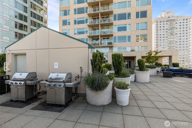 2600 2nd Ave Unit 504, Seattle, WA 98121 - view of patio with area for grilling and an outdoor hangout area