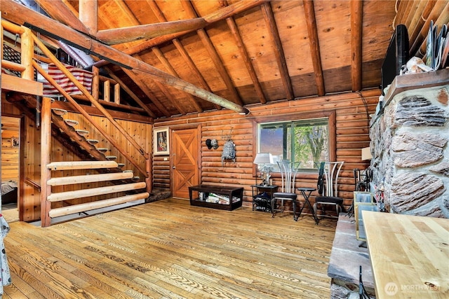 214 Inglewood Dr, Longview, WA 98632 - living area featuring hardwood / wood-style flooring, log walls, wooden ceiling with exposed beams, and high vaulted ceiling