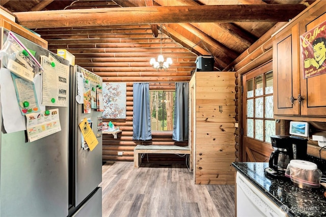 214 Inglewood Dr, Longview, WA 98632 - kitchen with freestanding refrigerator, plenty of natural light, rustic walls, light wood-style flooring, and wood ceiling