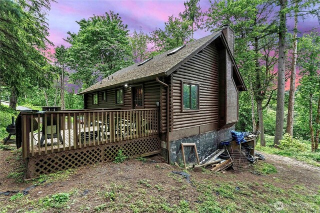 214 Inglewood Dr, Longview, WA 98632 - view of front of home featuring a chimney, a deck, and log exterior