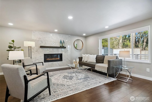 628 163rd Ave SE, Bellevue, WA 98008 - living room with baseboards, wood finished floors, a premium fireplace, and recessed lighting