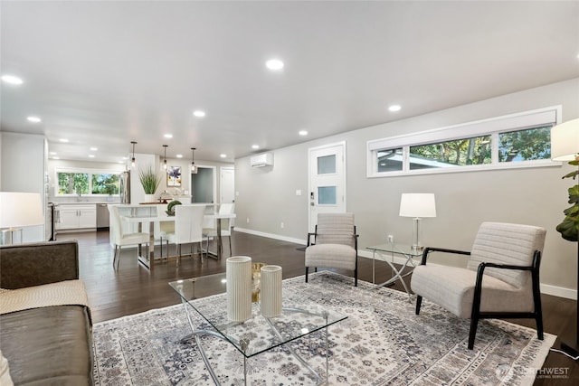 628 163rd Ave SE, Bellevue, WA 98008 - living area with a wall unit AC, dark wood-type flooring, recessed lighting, and baseboards