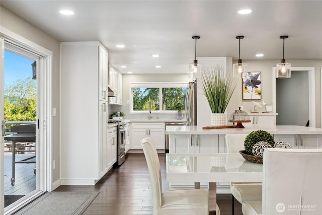 628 163rd Ave SE, Bellevue, WA 98008 - dining space with dark wood-style flooring, recessed lighting, and baseboards