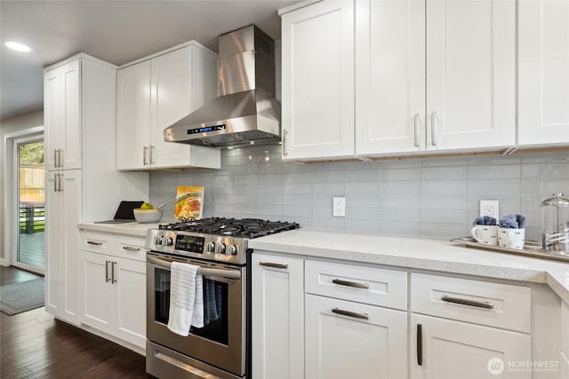 628 163rd Ave SE, Bellevue, WA 98008 - kitchen featuring wall chimney range hood, stainless steel gas range, white cabinetry, dark wood-type flooring, and recessed lighting