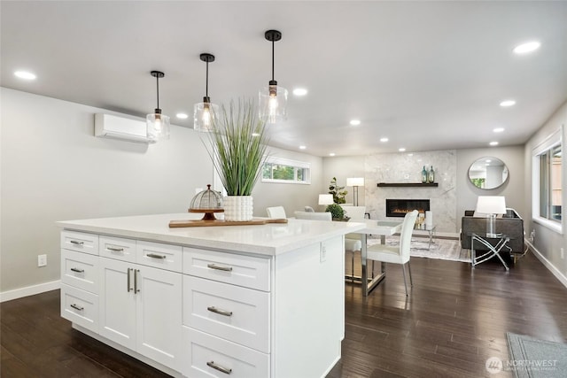 628 163rd Ave SE, Bellevue, WA 98008 - kitchen with an AC wall unit, dark wood-style flooring, recessed lighting, white cabinetry, and decorative light fixtures
