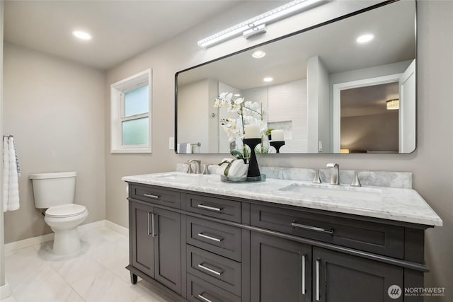 628 163rd Ave SE, Bellevue, WA 98008 - bathroom featuring baseboards, double vanity, toilet, recessed lighting, and marble look tile flooring