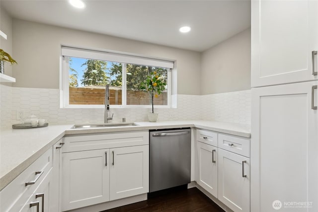 628 163rd Ave SE, Bellevue, WA 98008 - kitchen featuring stainless steel dishwasher, a sink, light countertops, white cabinets, and recessed lighting