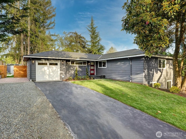 628 163rd Ave SE, Bellevue, WA 98008 - ranch-style house with an attached garage, driveway, and a front lawn