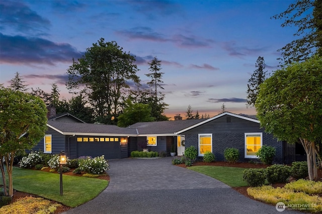 7834 SE 75th Pl, Mercer Island, WA 98040 - ranch-style home with a garage, a front lawn, a chimney, and decorative driveway