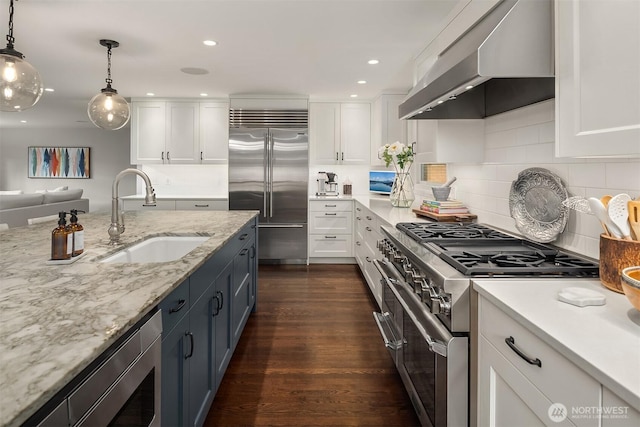 7834 SE 75th Pl, Mercer Island, WA 98040 - kitchen featuring range hood, a sink, high quality appliances, white cabinets, and dark wood-style floors