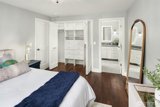 7834 SE 75th Pl, Mercer Island, WA 98040 - bedroom featuring dark wood-type flooring, a sink, ensuite bath, a closet, and baseboards