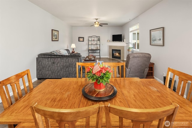 363 Franks Ln N, Enumclaw, WA 98022 - dining room featuring ceiling fan and a tiled fireplace