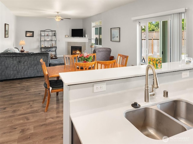 363 Franks Ln N, Enumclaw, WA 98022 - kitchen featuring a ceiling fan, wood finished floors, light countertops, open floor plan, and healthy amount of natural light