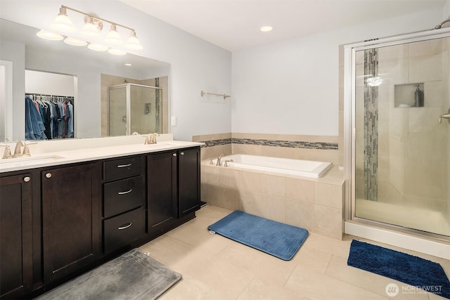 363 Franks Ln N, Enumclaw, WA 98022 - full bath featuring a shower stall, a bath, tile patterned floors, a walk in closet, and double vanity