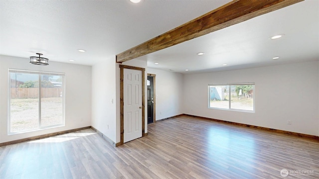 40 Utke Ln, Omak, WA 98841 - empty room with light wood-style flooring, baseboards, recessed lighting, and beam ceiling