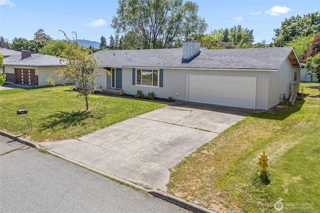 13524 E 5th Ave, Spokane Valley, WA 99216 - ranch-style house featuring a chimney, an attached garage, a front lawn, and driveway