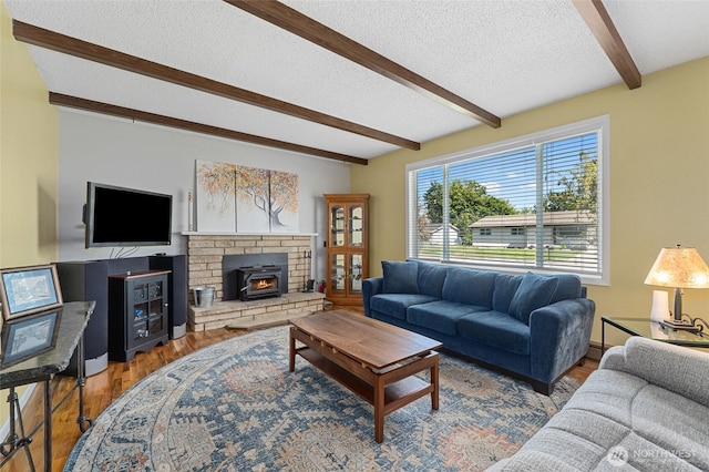 13524 E 5th Ave, Spokane Valley, WA 99216 - living room featuring beamed ceiling, a textured ceiling, and wood finished floors