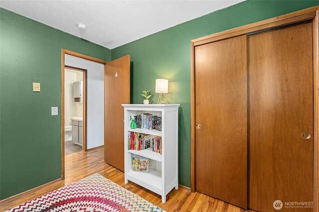 13524 E 5th Ave, Spokane Valley, WA 99216 - bedroom featuring wood finished floors, a closet, and baseboards