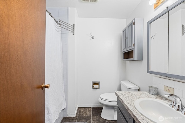 13524 E 5th Ave, Spokane Valley, WA 99216 - full bath featuring toilet, vanity, baseboards, and curtained shower