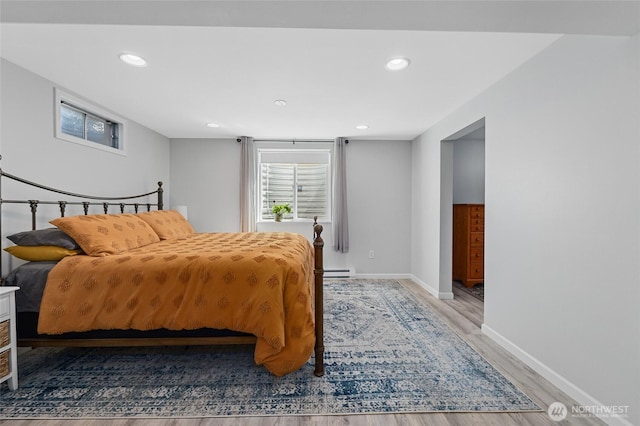 13524 E 5th Ave, Spokane Valley, WA 99216 - bedroom with light wood-type flooring, a baseboard heating unit, baseboards, and recessed lighting