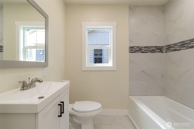 605 Holly St, Walla Walla, WA 99362 - bathroom featuring vanity, toilet, baseboards, and shower / bath combination