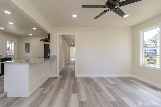 605 Holly St, Walla Walla, WA 99362 - kitchen featuring dishwasher, light wood-style floors, light stone counters, recessed lighting, and baseboards