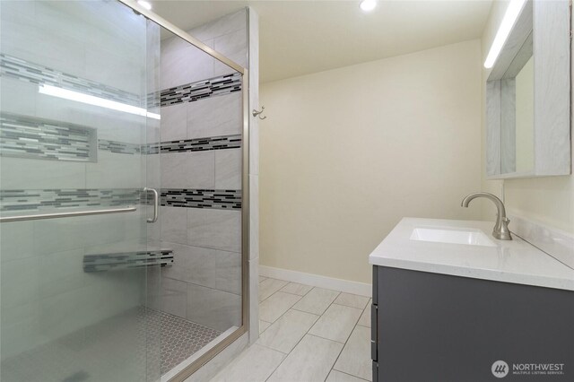 605 Holly St, Walla Walla, WA 99362 - bathroom featuring vanity, a shower stall, and baseboards