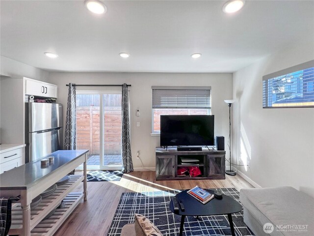 1042 S Donovan St Unit 5, Seattle, WA 98108 - living area with baseboards, recessed lighting, and light wood finished floors
