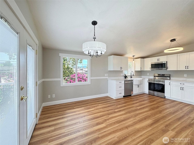 1538 W 12th St, Port Angeles, WA 98363 - kitchen featuring appliances with stainless steel finishes, light countertops, and healthy amount of natural light