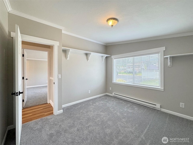 1538 W 12th St, Port Angeles, WA 98363 - empty room featuring a baseboard heating unit, carpet floors, ornamental molding, and baseboards