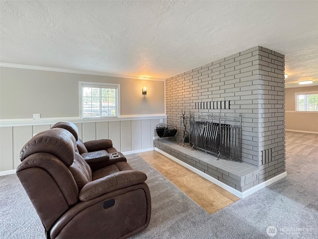 1538 W 12th St, Port Angeles, WA 98363 - living room featuring carpet, a textured ceiling, crown molding, a brick fireplace, and a wainscoted wall