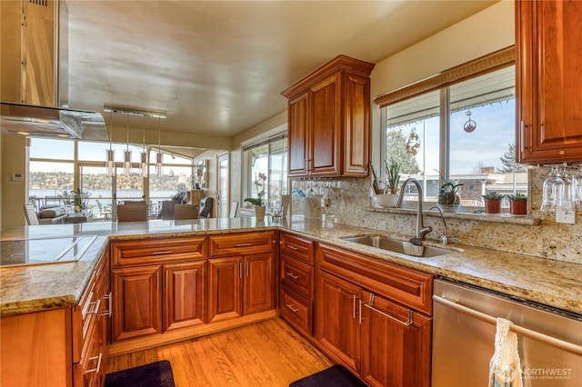 10008 Rainier Ave S, Seattle, WA 98178 - kitchen featuring a sink, dishwasher, white electric cooktop, light wood-type flooring, and range hood