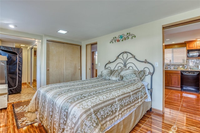10008 Rainier Ave S, Seattle, WA 98178 - bedroom featuring a sink, a closet, recessed lighting, and wood finished floors