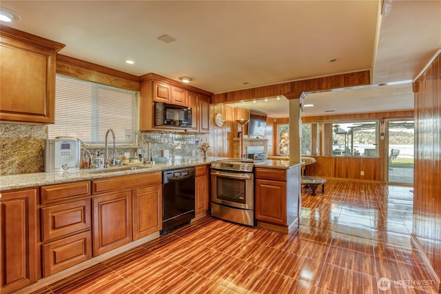 10008 Rainier Ave S, Seattle, WA 98178 - kitchen with black appliances, a sink, backsplash, a peninsula, and recessed lighting