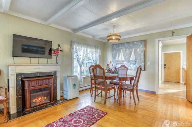 10008 Rainier Ave S, Seattle, WA 98178 - dining area featuring a high end fireplace, hardwood / wood-style flooring, ornamental molding, beam ceiling, and a baseboard radiator