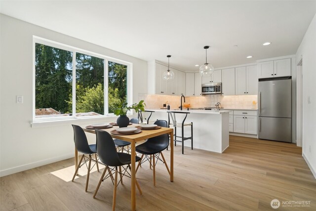 20315 14th Ave NE Unit A & B, Shoreline, WA 98155 - dining area with light wood-type flooring, recessed lighting, and baseboards